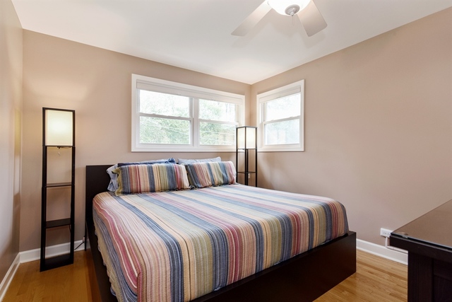 1425 Brummel Street Evanston, IL 60202 - Photo 11 of 24 a bedroom with a bed and a window