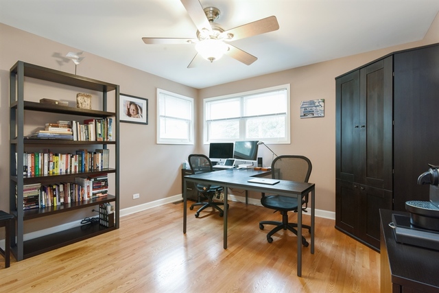 1425 Brummel Street Evanston, IL 60202 - Photo 13 of 24 a view of a workspace with furniture and a bookshelf