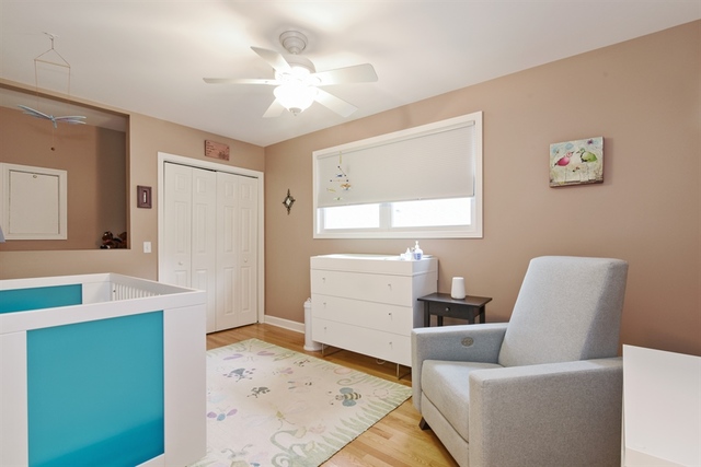 1425 Brummel Street Evanston, IL 60202 - Photo 14 of 24 a living room with furniture and a dresser