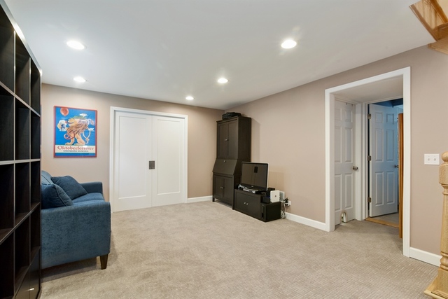 1425 Brummel Street Evanston, IL 60202 - Photo 16 of 24 a living room with furniture a refrigerator and a couch