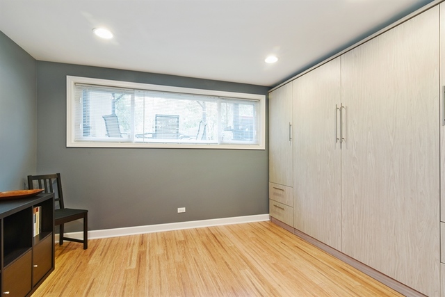 1425 Brummel Street Evanston, IL 60202 - Photo 18 of 24 a view of an empty room with wooden floor and a window