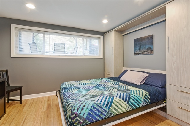 1425 Brummel Street Evanston, IL 60202 - Photo 19 of 24 a bedroom with a bed and wooden floor