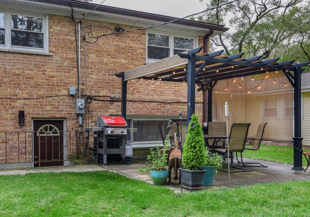 1425 Brummel Street Evanston, IL 60202 - Photo 21 of 24 a view of a chair and table in backyard of the house