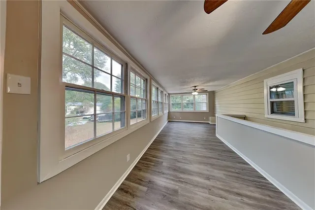 a view of a house with wooden floor and windows