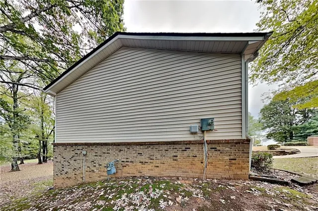 a side view of a house with a yard