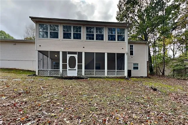 a house with trees in the background