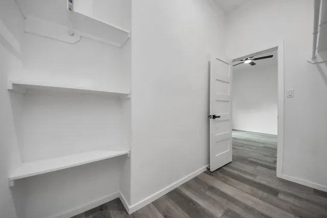 a bathroom with a walk in closet