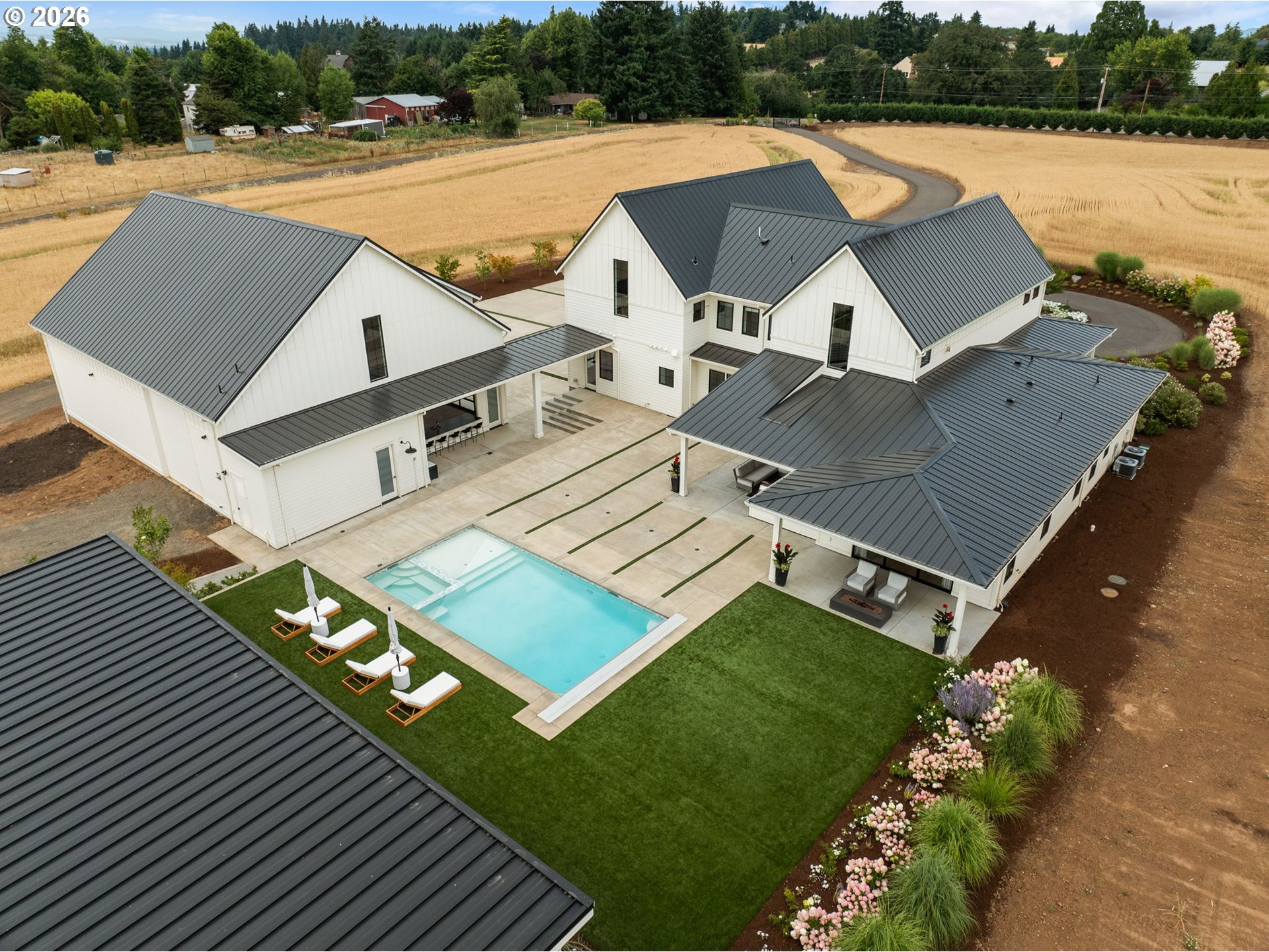 22280 Southwest Stafford Road Tualatin, OR 97062 - Photo 6 of 48 a view of a house with pool and chairs