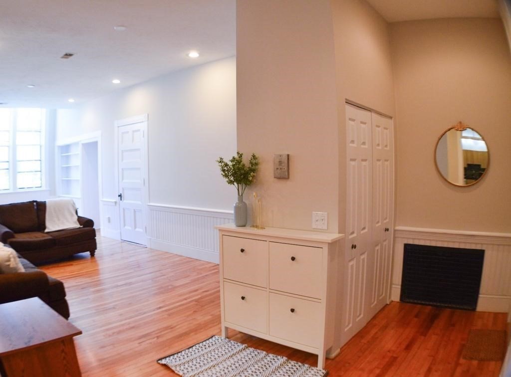 31 Elizabeth Street, Unit 202 Worcester, MA 01605 - Photo 2 of 12 a view of a livingroom with wooden floor