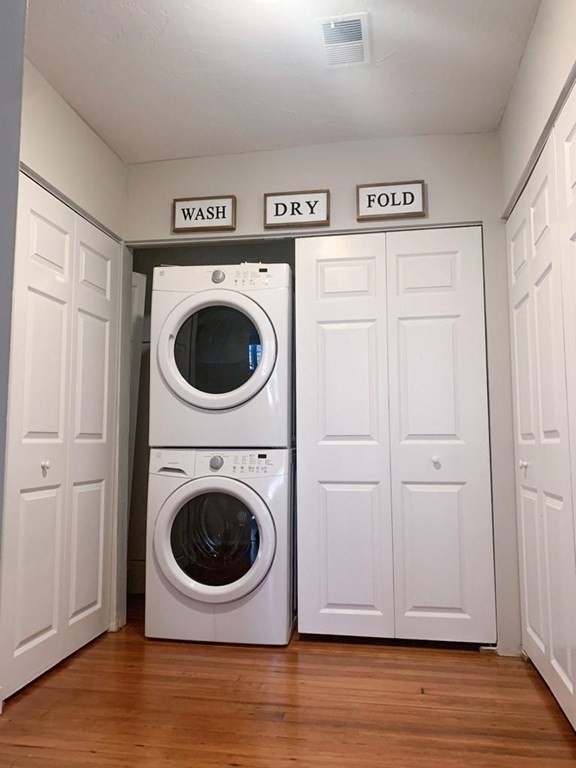 31 Elizabeth Street, Unit 202 Worcester, MA 01605 - Photo 6 of 12 a view of a hallway with washer and dryer