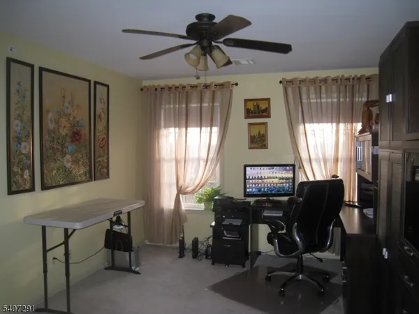 a workspace with furniture and a window