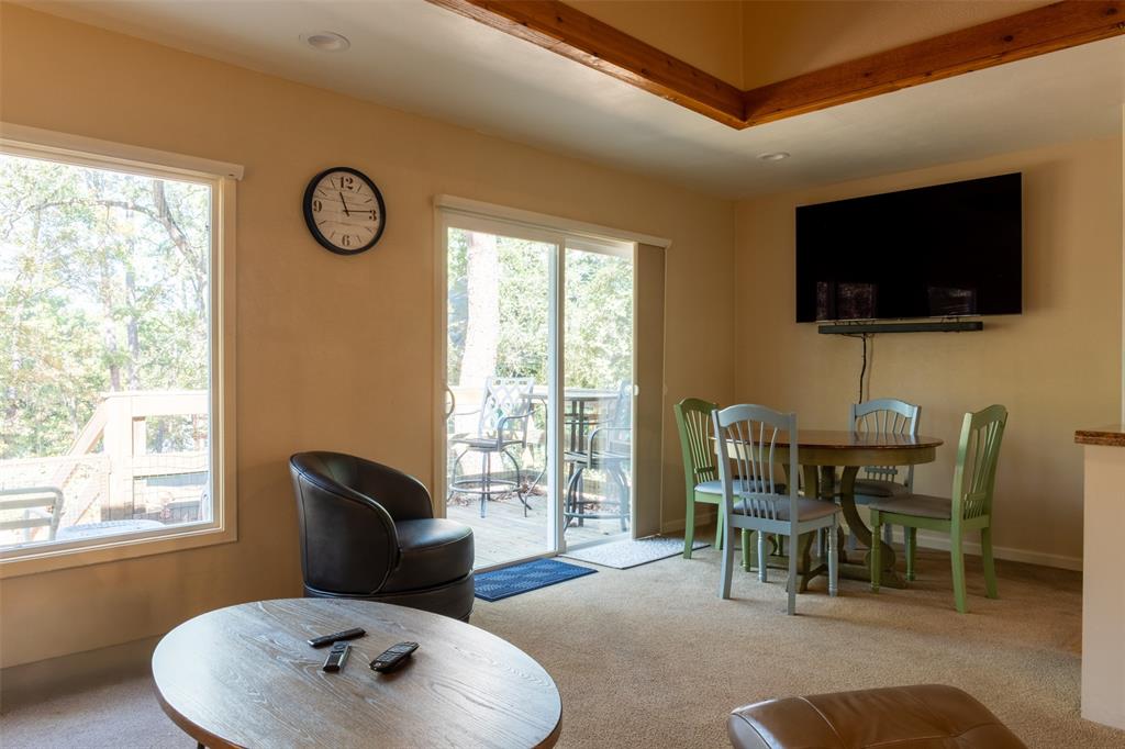 167 Blue Water Point Holly Lake Ranch, TX 75765 - Photo 5 of 27 Recessed lighting, wood-finish ceiling beams, and a mounted flat-screen display