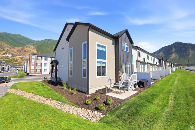 4646 Alder Drive, Unit 223 Mapleton, UT 84664 - Photo 20 of 35 Modern townhome exterior featuring contemporary vertical siding accents and a contrasting stucco finish