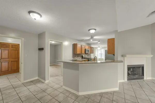 a kitchen with stainless steel appliances a sink and a refrigerator