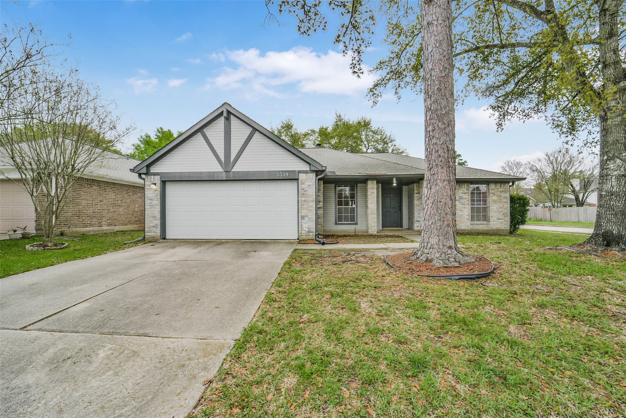 5539 Rivertree Lane Spring, TX 77379 - Photo 2 of 25 a front view of a house with garden