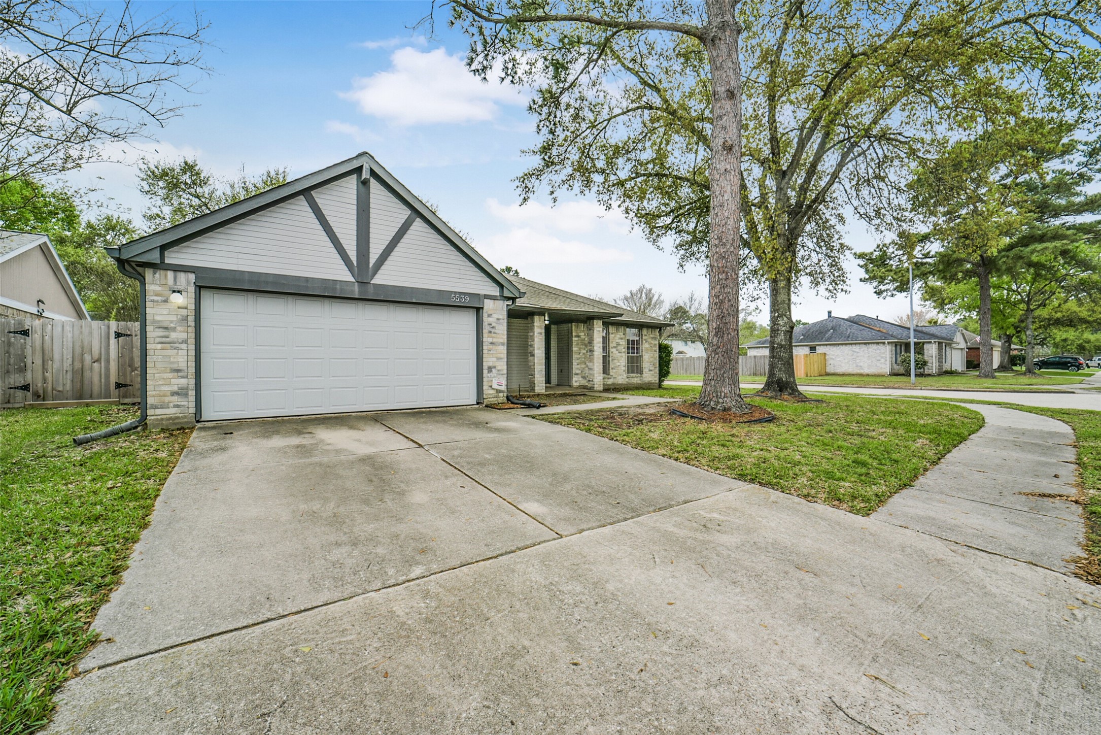 5539 Rivertree Lane Spring, TX 77379 - Photo 3 of 25 a house with trees in front of it