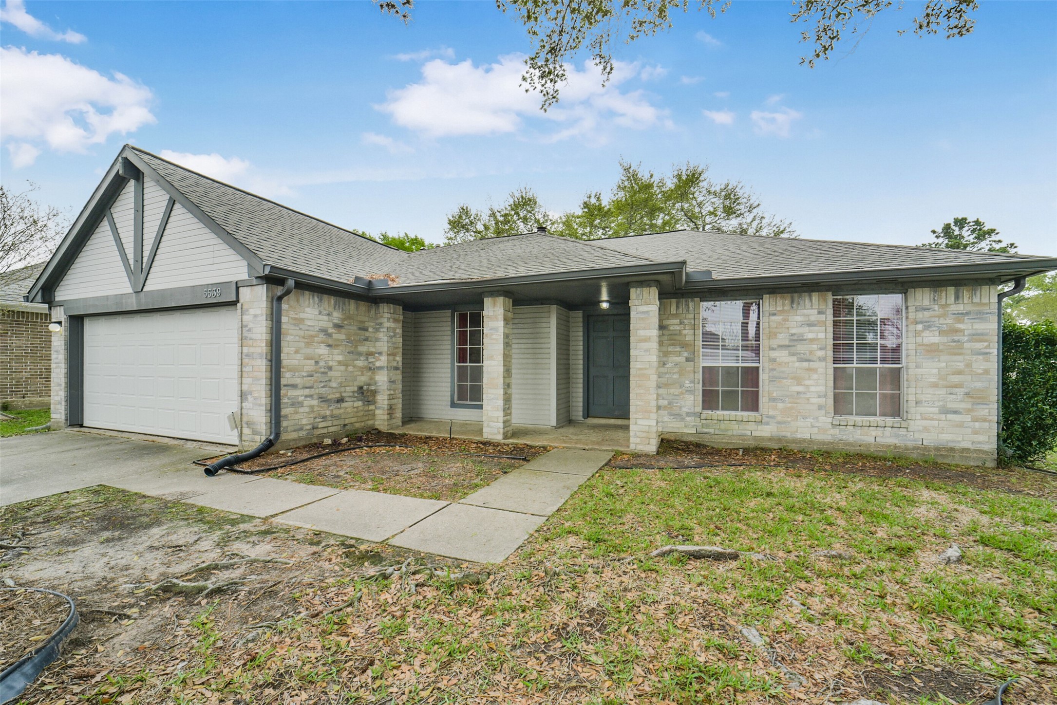 5539 Rivertree Lane Spring, TX 77379 - Photo 5 of 25 front view of a house with a yard