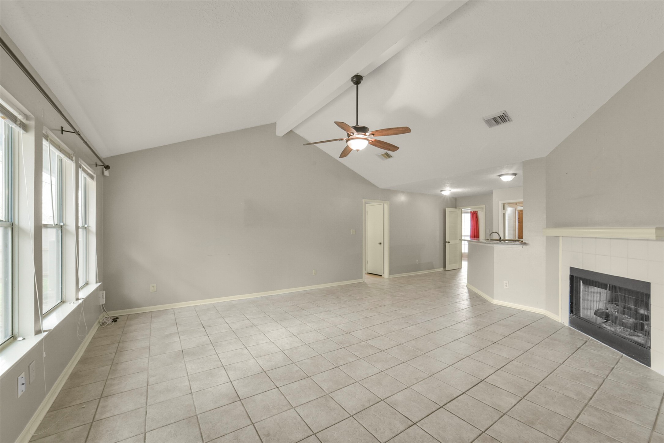 5539 Rivertree Lane Spring, TX 77379 - Photo 9 of 25 an empty room with windows and fireplace