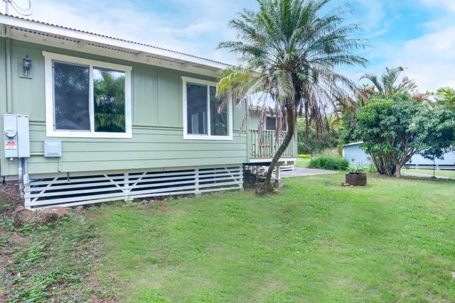 a house view with a garden space
