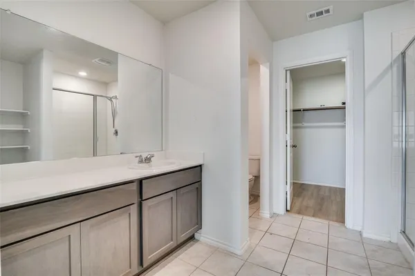 a bathroom with a sink a vanity and a mirror