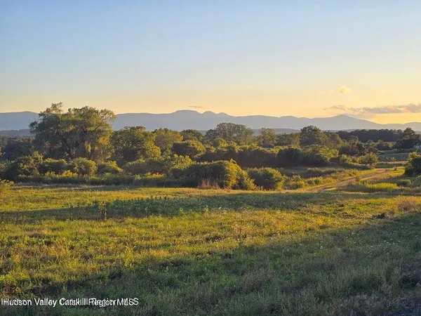 a view of an ocean from a mountain