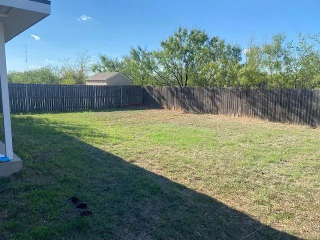 a view of a yard with an outdoor space and seating