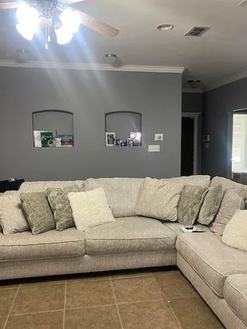 a living room with furniture and a couch