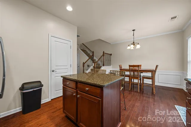 a view of a kitchen with a sink and cabinets
