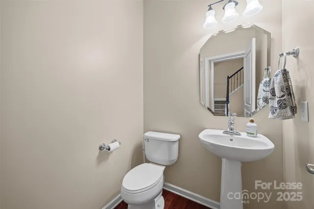 a view of entryway livingroom and hall with wooden floor