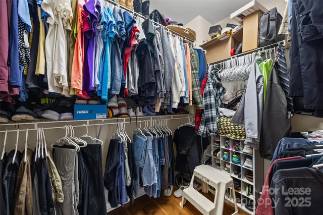 a bathroom with a granite countertop sink a toilet and a mirror