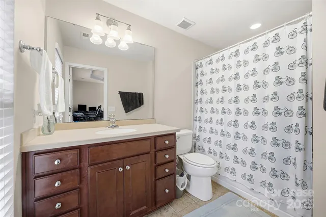 a room with gym equipment and a window