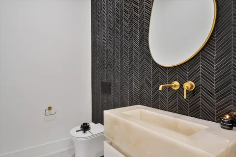 a bathroom with a shower sink and mirror