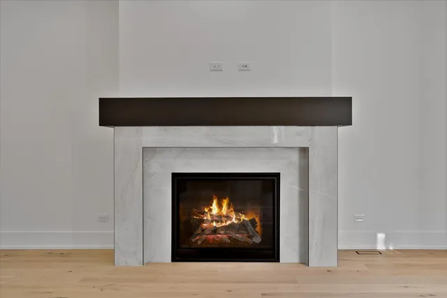 a view of staircase with wooden floor and a window
