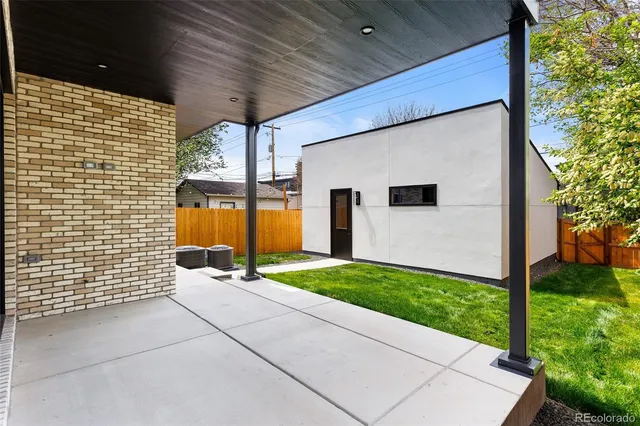 a aerial view of a house with a garden and barbeque oven