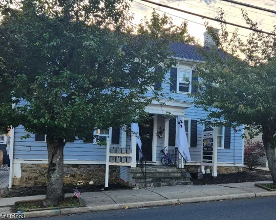 a front view of a house with yard