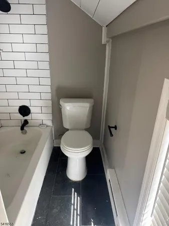 a bathroom with a toilet and a sink