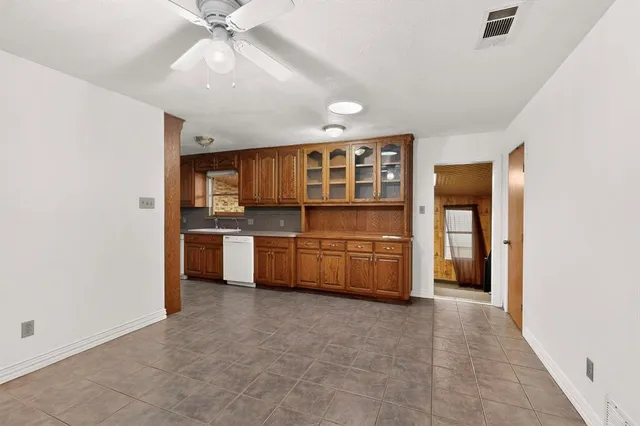 a view of a kitchen with furniture and window