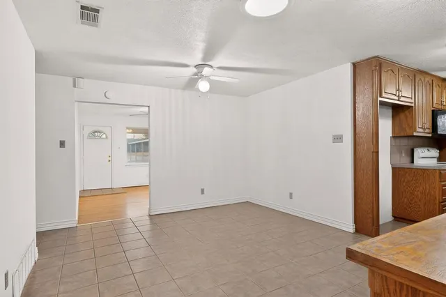 a view of a kitchen with an empty space
