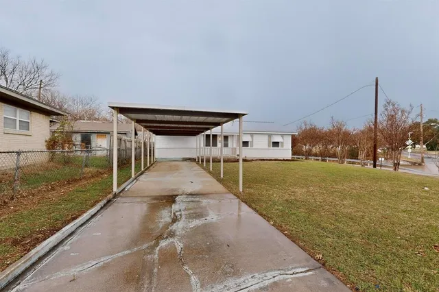 a view of a patio with a yard