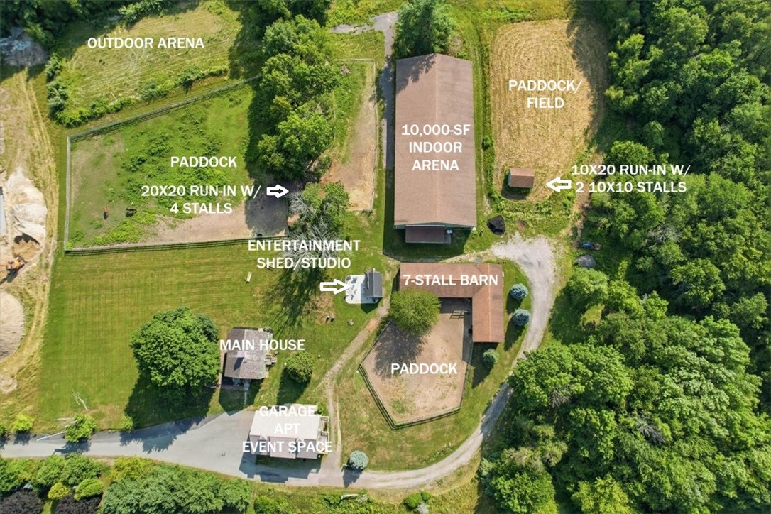 32 Equestrian Way Cranston, RI 02921 - Photo 12 of 48 LAND WITH POSSIBILITY: Potential future subdivision or development — subject to approvals. ESTABLISHED EQUESTRIAN INFRASTRUCTURE: Arena • Barn • Paddocks • Run-Ins - The efficient layout places the 7-stall barn between fenced turnout areas, the riding facilities & the property’s looping internal drive.