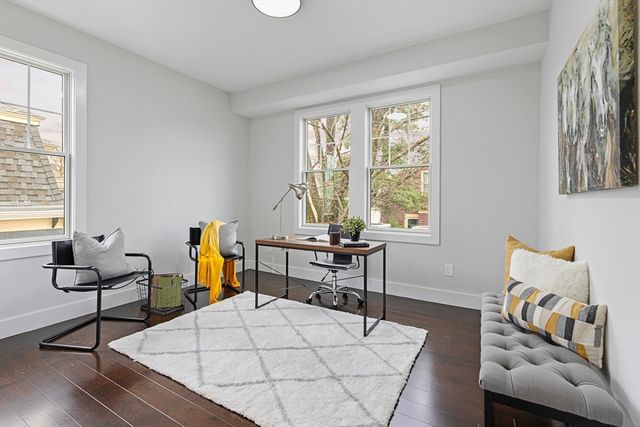 a work room with furniture and wooden floor