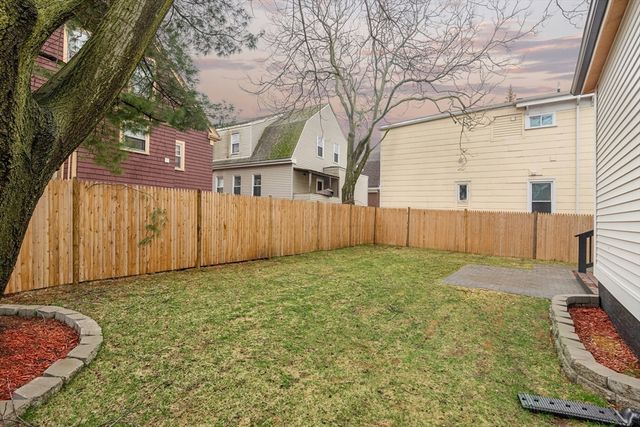 a view of a backyard with a small cabin