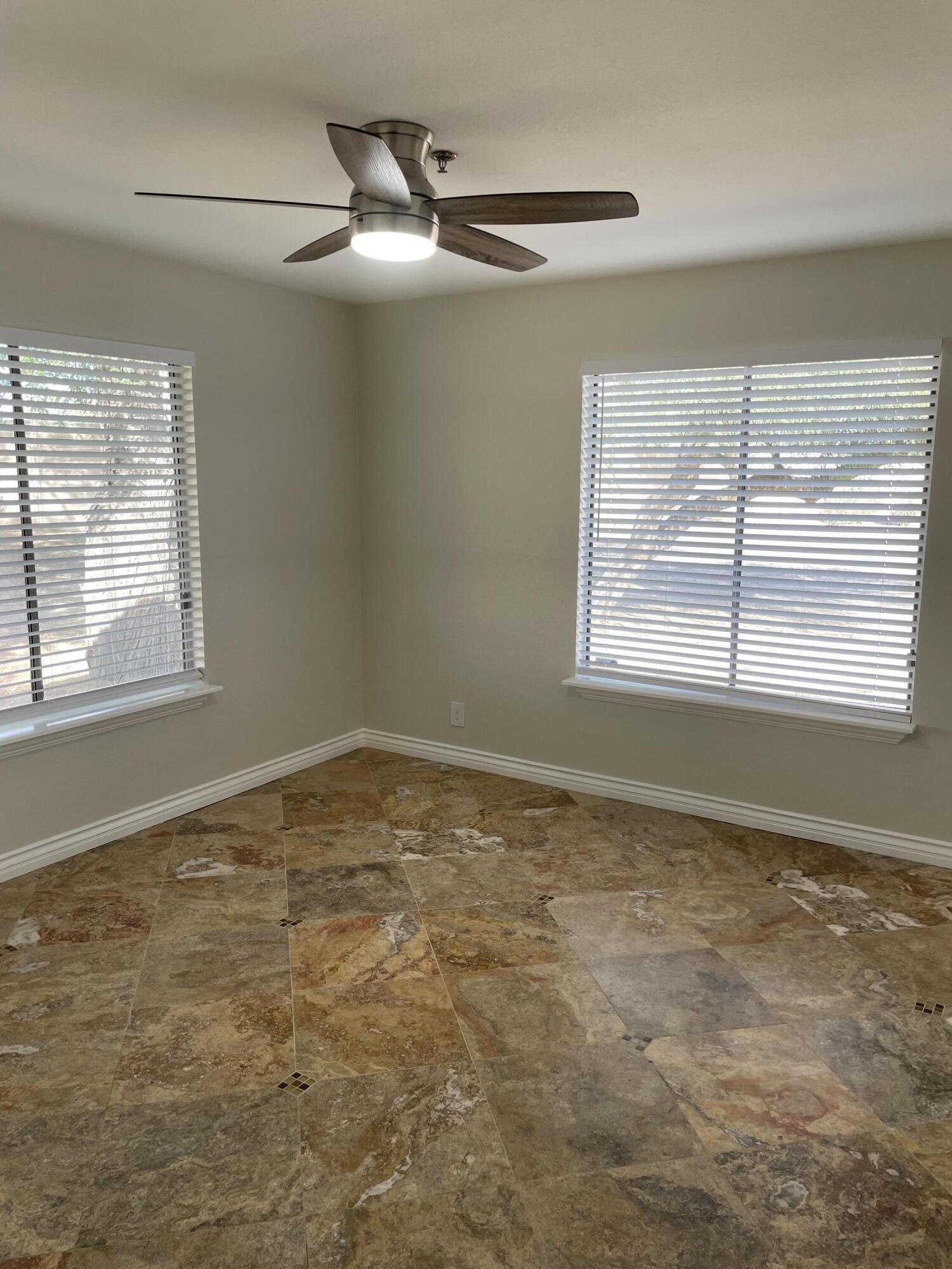 43376 Cook Street, Unit 52 Palm Desert, CA 92211 - Photo 15 of 42 a view of an empty room with a window