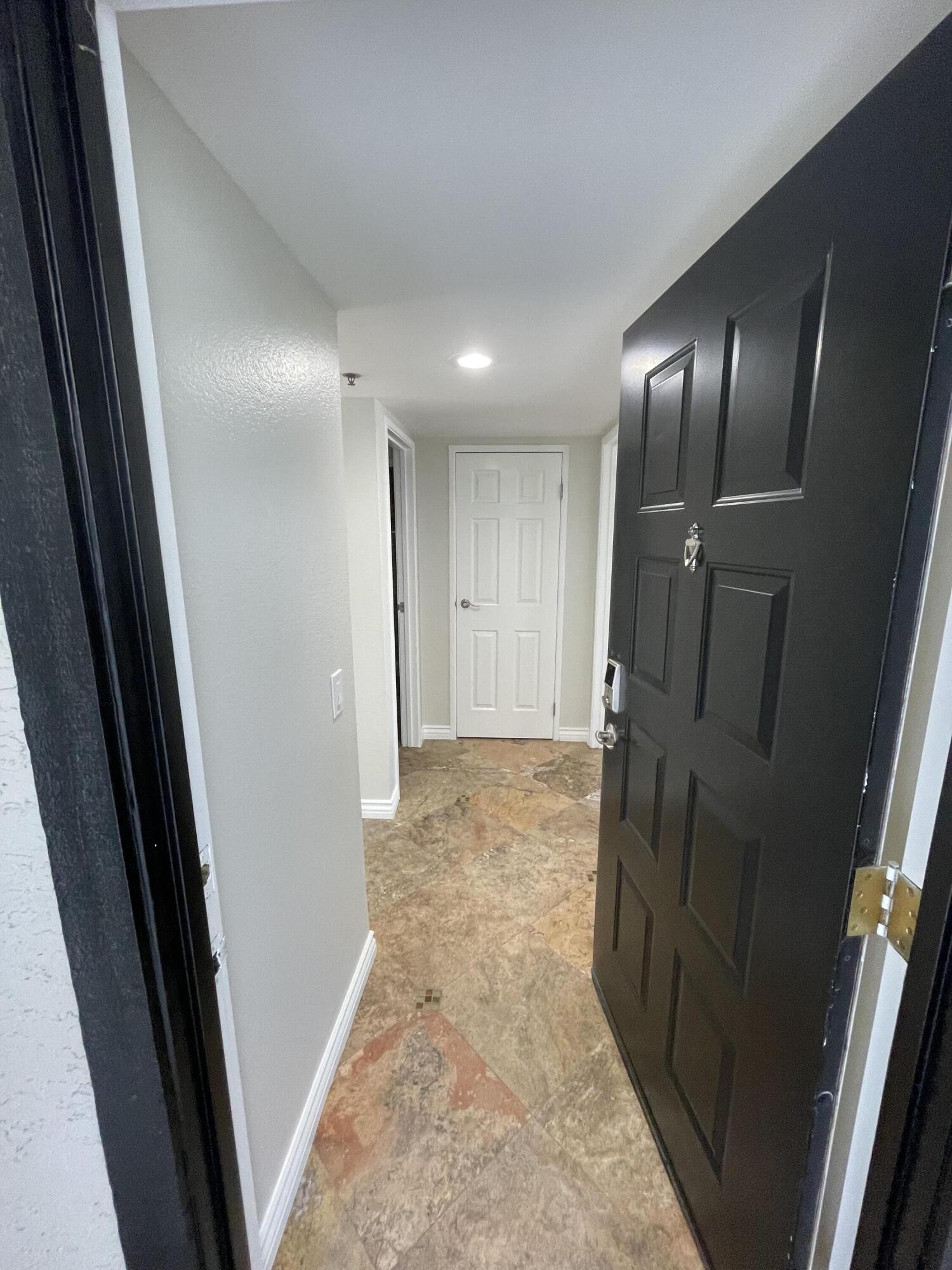 43376 Cook Street, Unit 52 Palm Desert, CA 92211 - Photo 21 of 42 a view of hallway with stainless steel appliances wooden floor