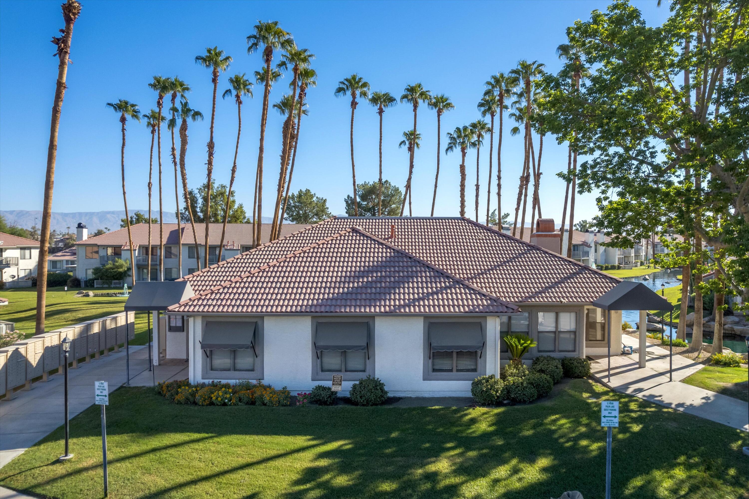 43376 Cook Street, Unit 52 Palm Desert, CA 92211 - Photo 29 of 42 a view of a house with garden and plants
