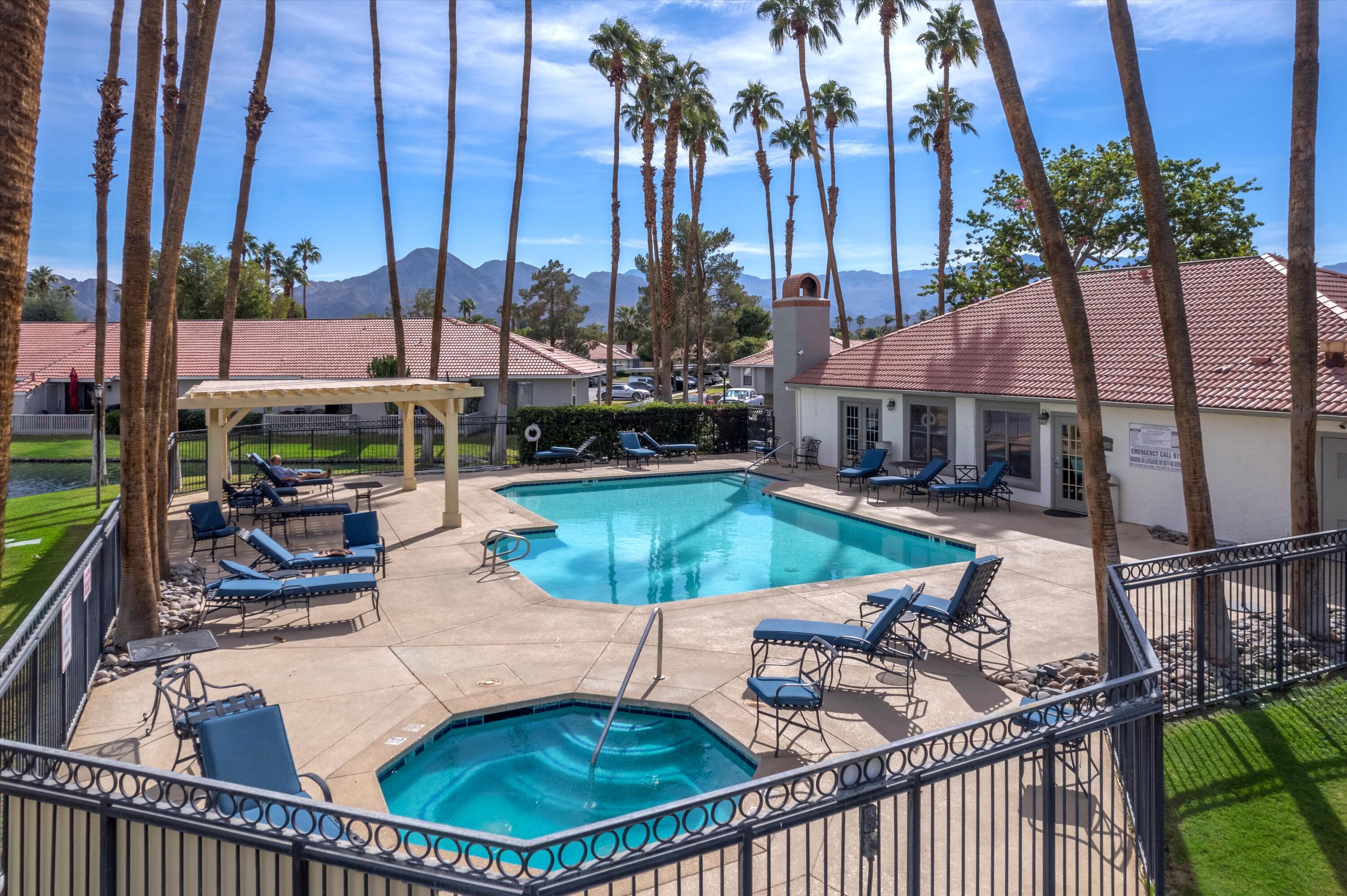 43376 Cook Street, Unit 52 Palm Desert, CA 92211 - Photo 38 of 42 a view of a house with swimming pool and sitting area