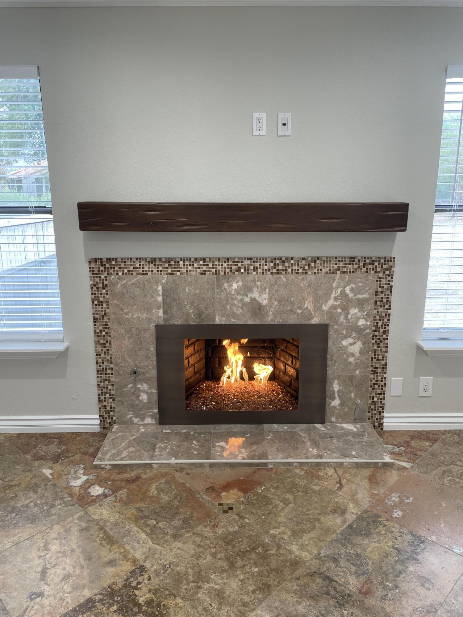 43376 Cook Street, Unit 52 Palm Desert, CA 92211 - Photo 7 of 42 a fireplace with a fireplace