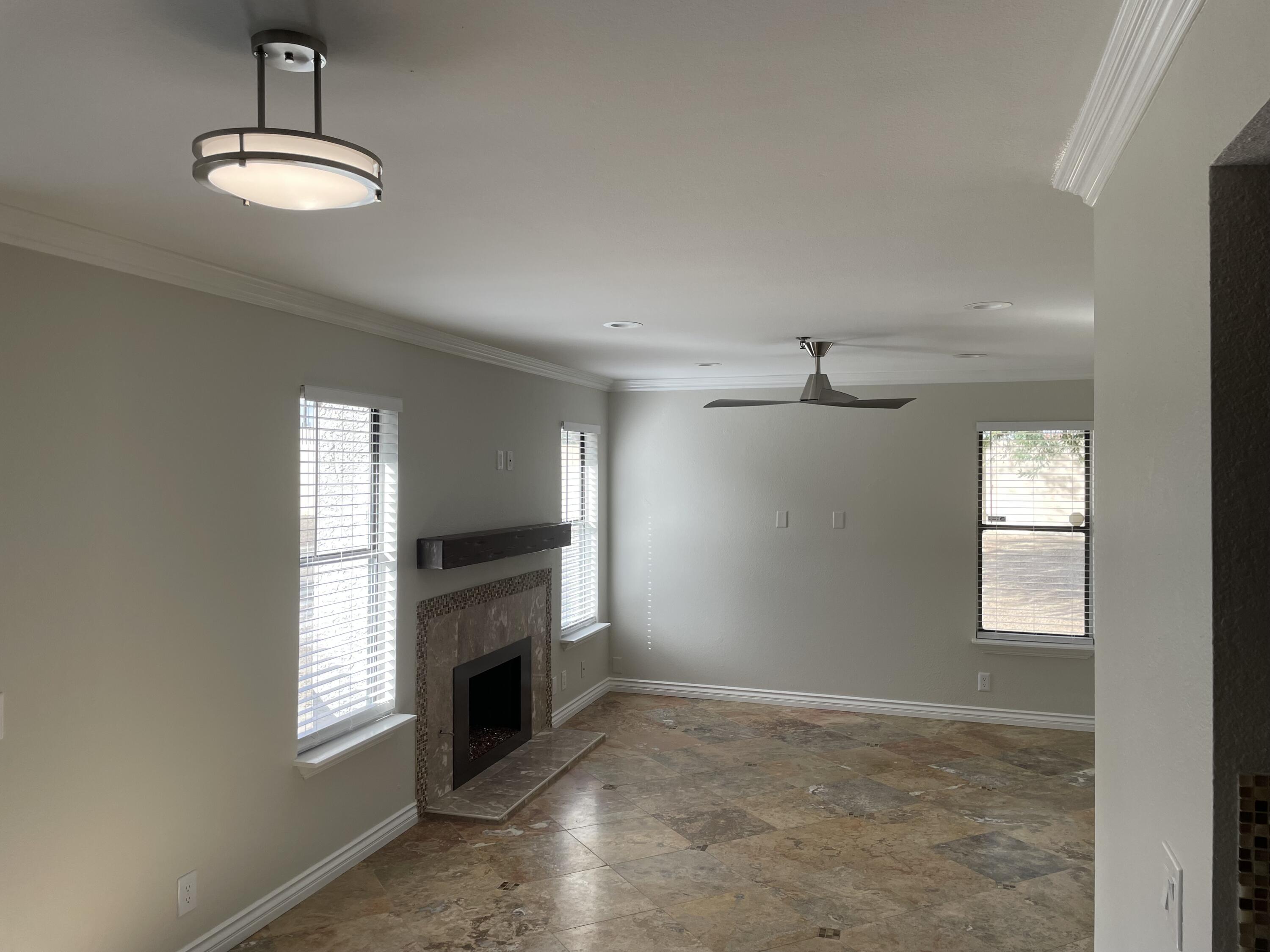 43376 Cook Street, Unit 52 Palm Desert, CA 92211 - Photo 9 of 42 a view of a livingroom with a fireplace window and a fireplace