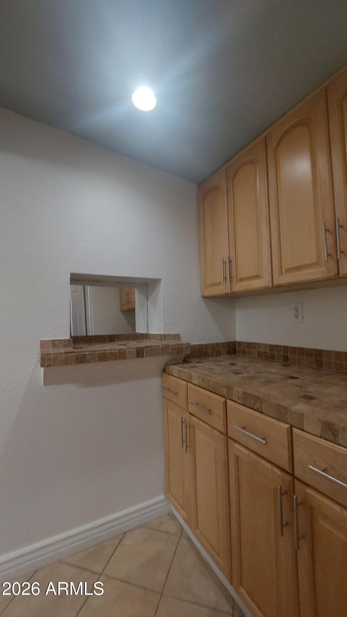 2448 West Freeway Lane Phoenix, AZ 85021 - Photo 21 of 27 a kitchen with cabinets appliances and a sink