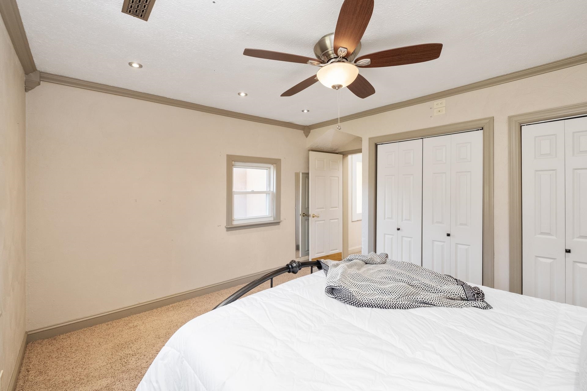 1426 Middlebrook Road Staunton, VA 24401 - Photo 20 of 45 a bedroom with a large bed and a chandelier